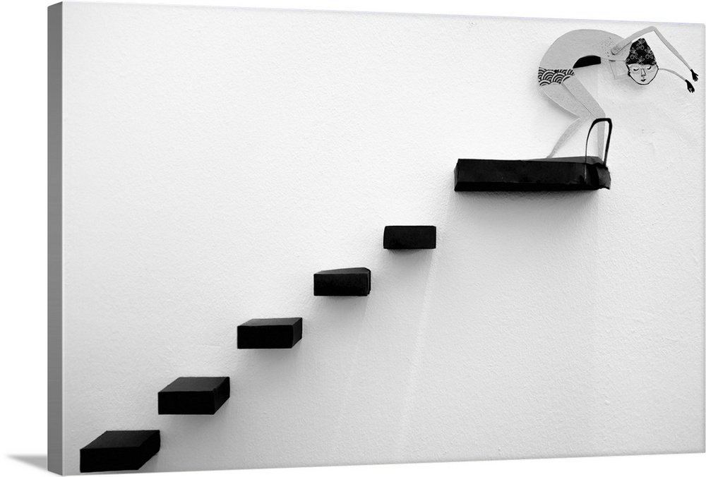 Cut-paper figure of a diver at the top of a staircase on a wall.