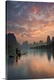 image thumbnail of A fisherman on a boat in the Li River, with beautifully colored clouds at sunrise, China.