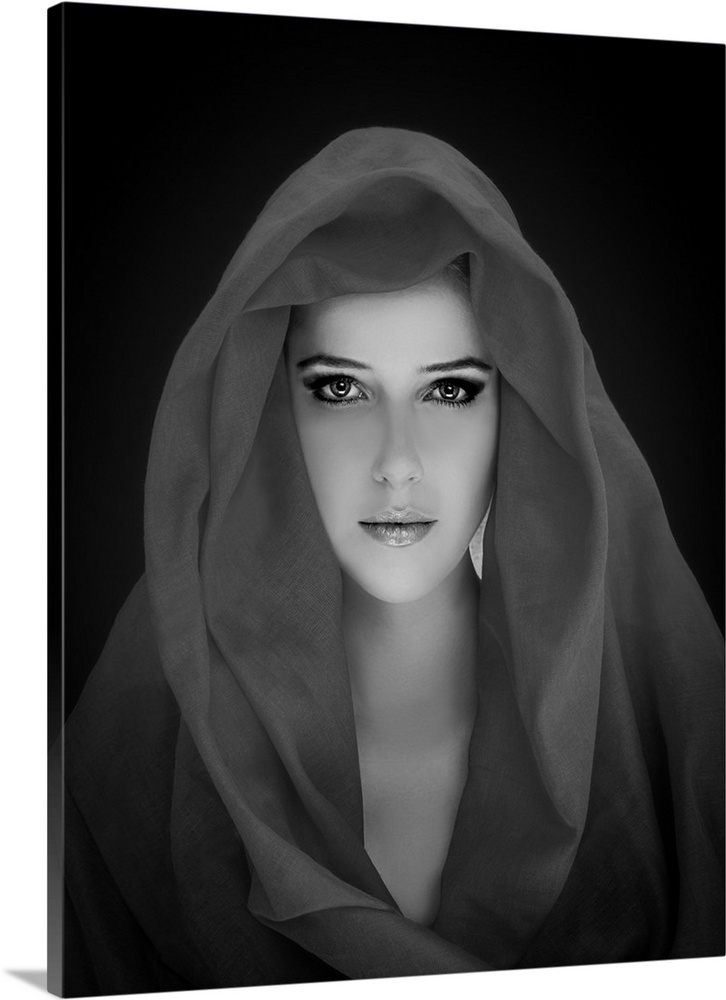 Black and white portrait of a beautiful woman wearing a veil.