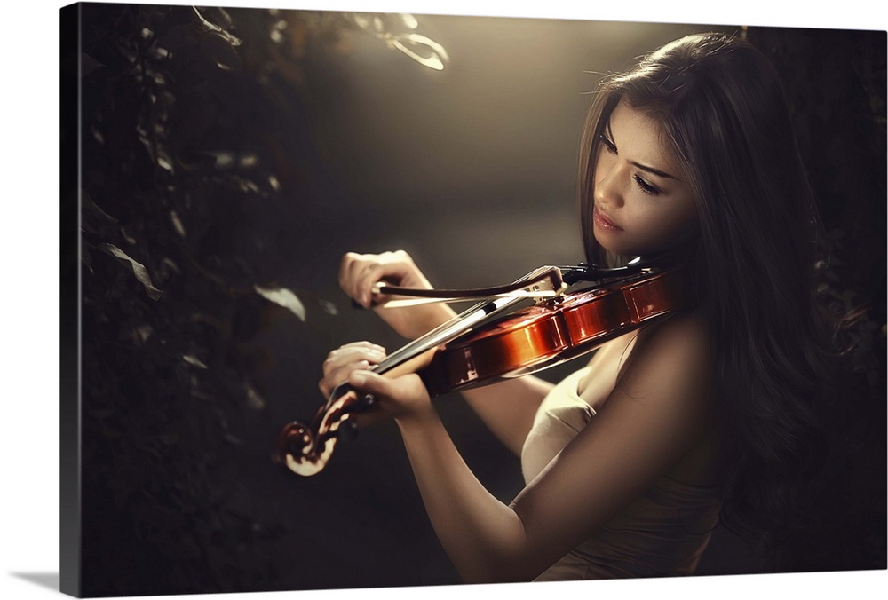 A beautiful woman with long dark hair playing a violin.