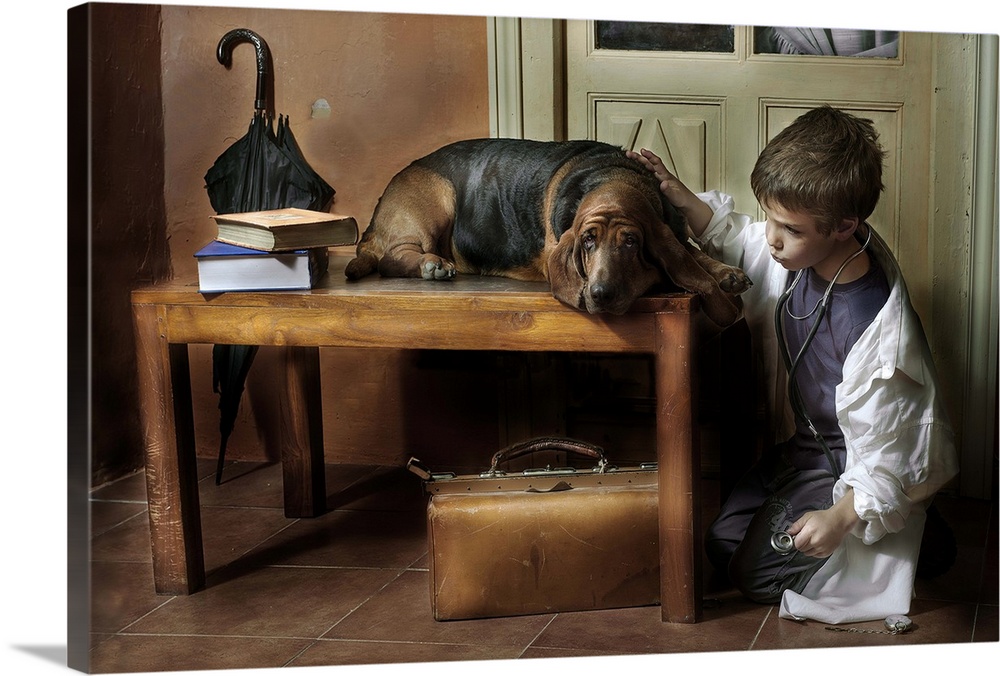 A young boy wearing a stethoscope plays veterinarian with his Basset hound.