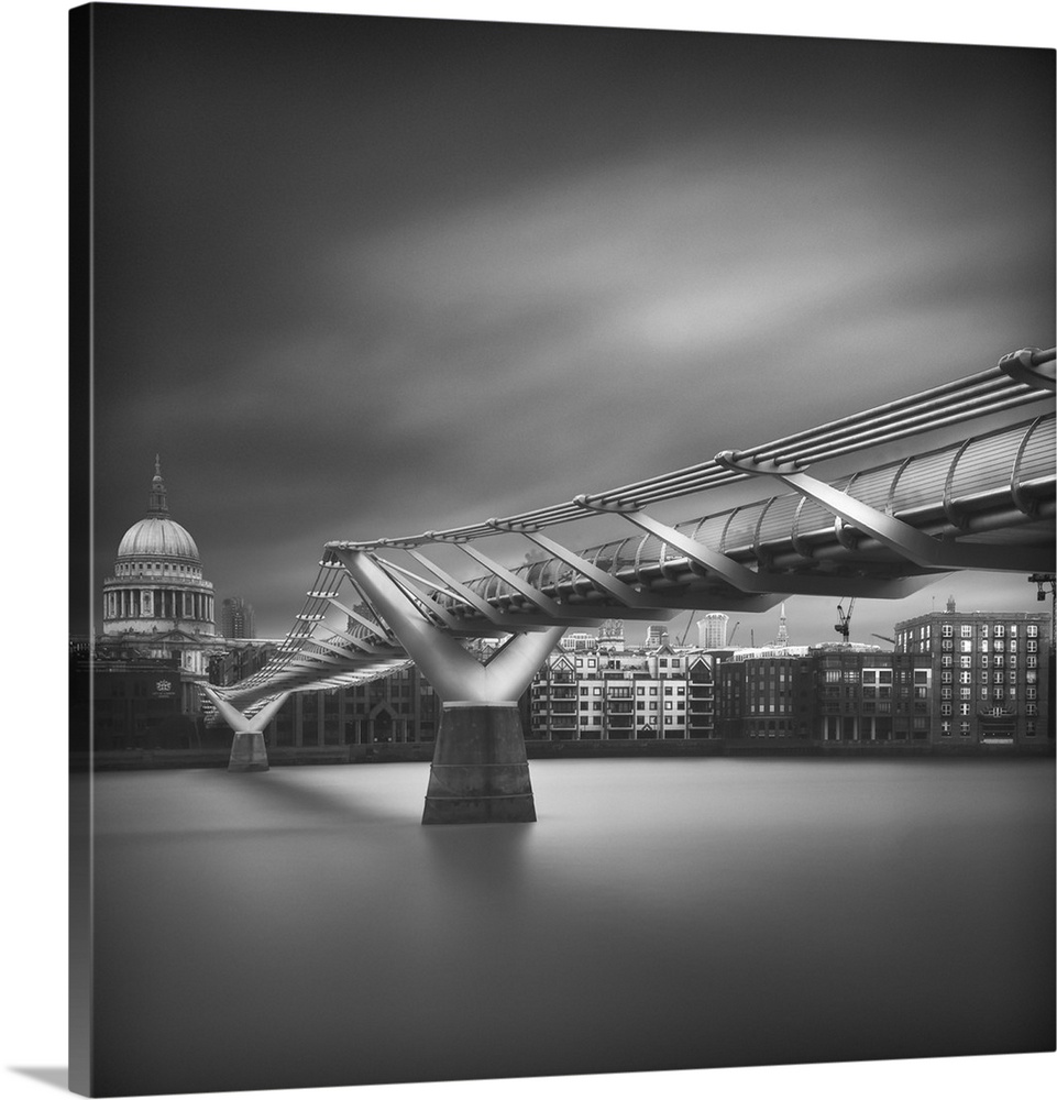 Square black and white photograph of the Millennium Bridge with St. Paul's Cathedral in the background.