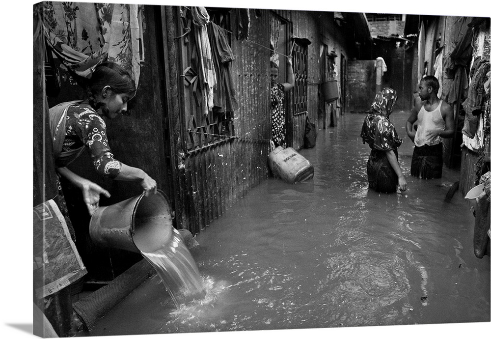 Slums of lower part of Dhaka City, Bangladesh, get flooded after every heavy rainfall. Water enters into their houses. The...