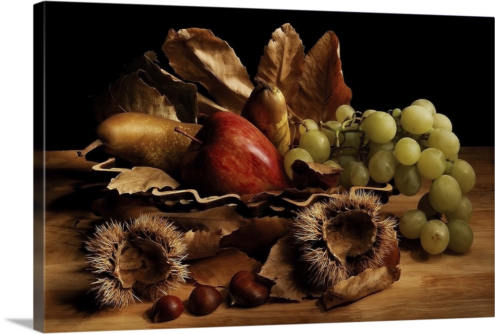 Still life arrangement with green grapes, a red apple, pears, fallen leaves, and chestnuts with their spiky coverings.