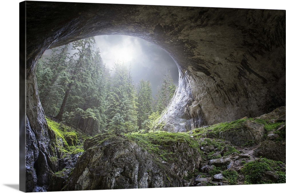 Wide natural arch of a cave in a forest, in Marvelous Bridges, Bulgaria.