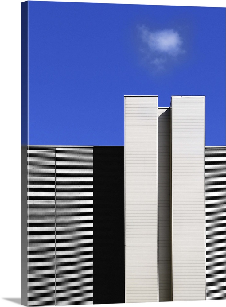 Architectural elements creating rectangular shapes, under a blue sky, Poland.
