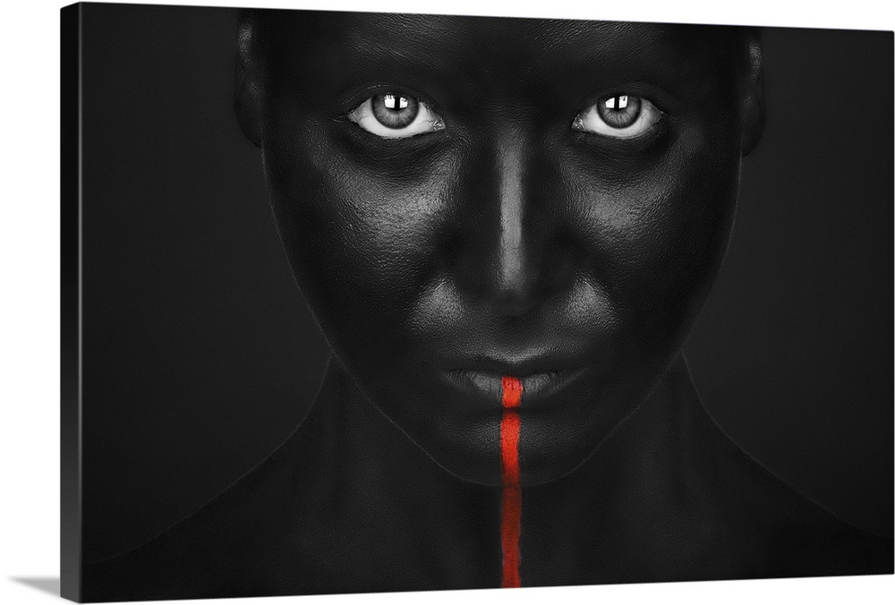A person with completely black bodypaint covering their face with a single red stripe running down from their mouth.