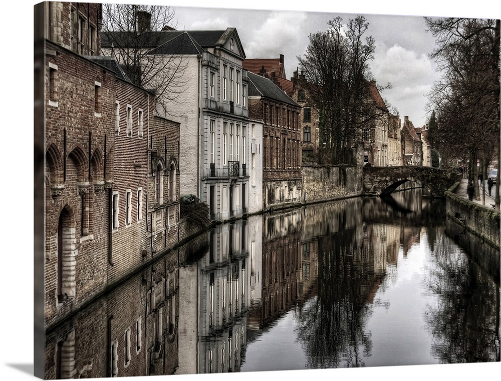 Canal in the city of Bruges, Belgium, on a cloudy day in the winter.