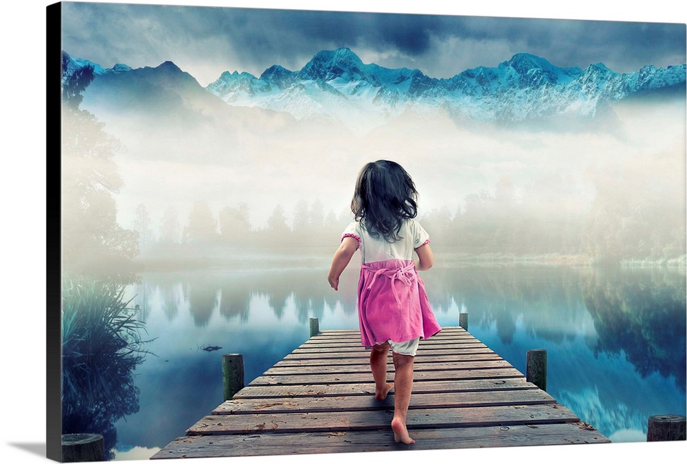 A young girl running on a wooden pier to a misty lake in the mountains.