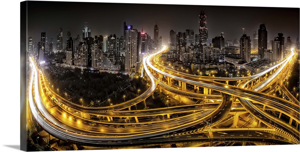 Shanghai city skyline with intersecting highways glowing with light trails from zooming cars.