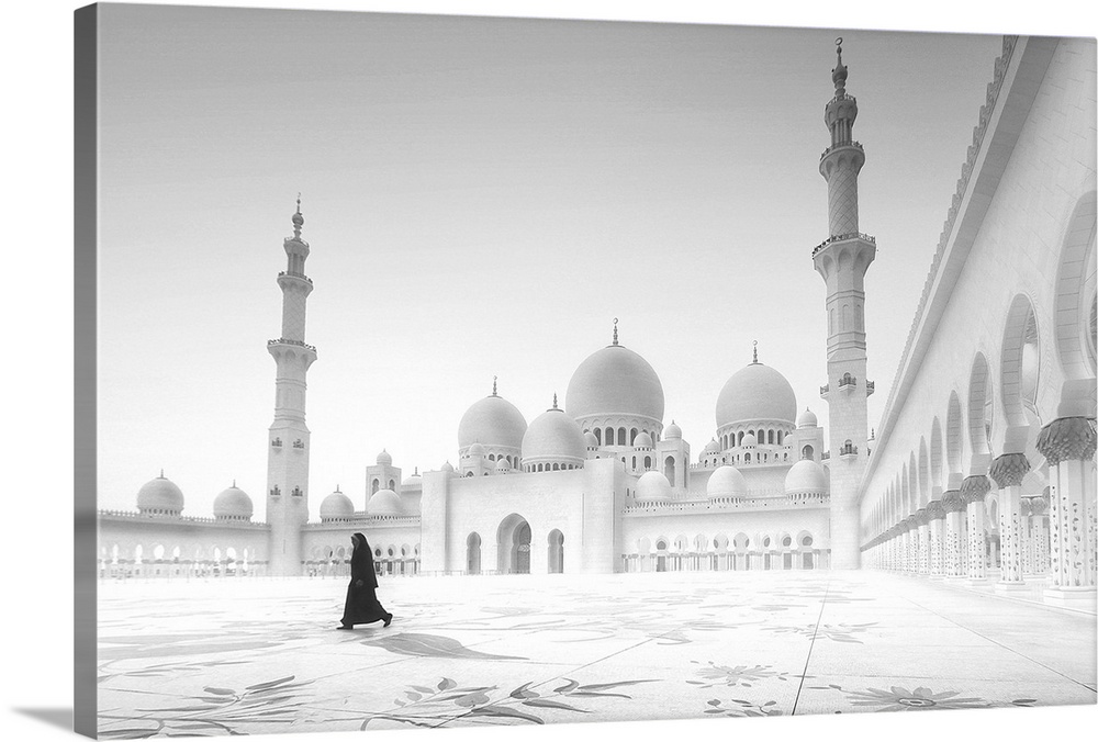 A woman walks in the courtyard of a mosque in Abu Dhabi.