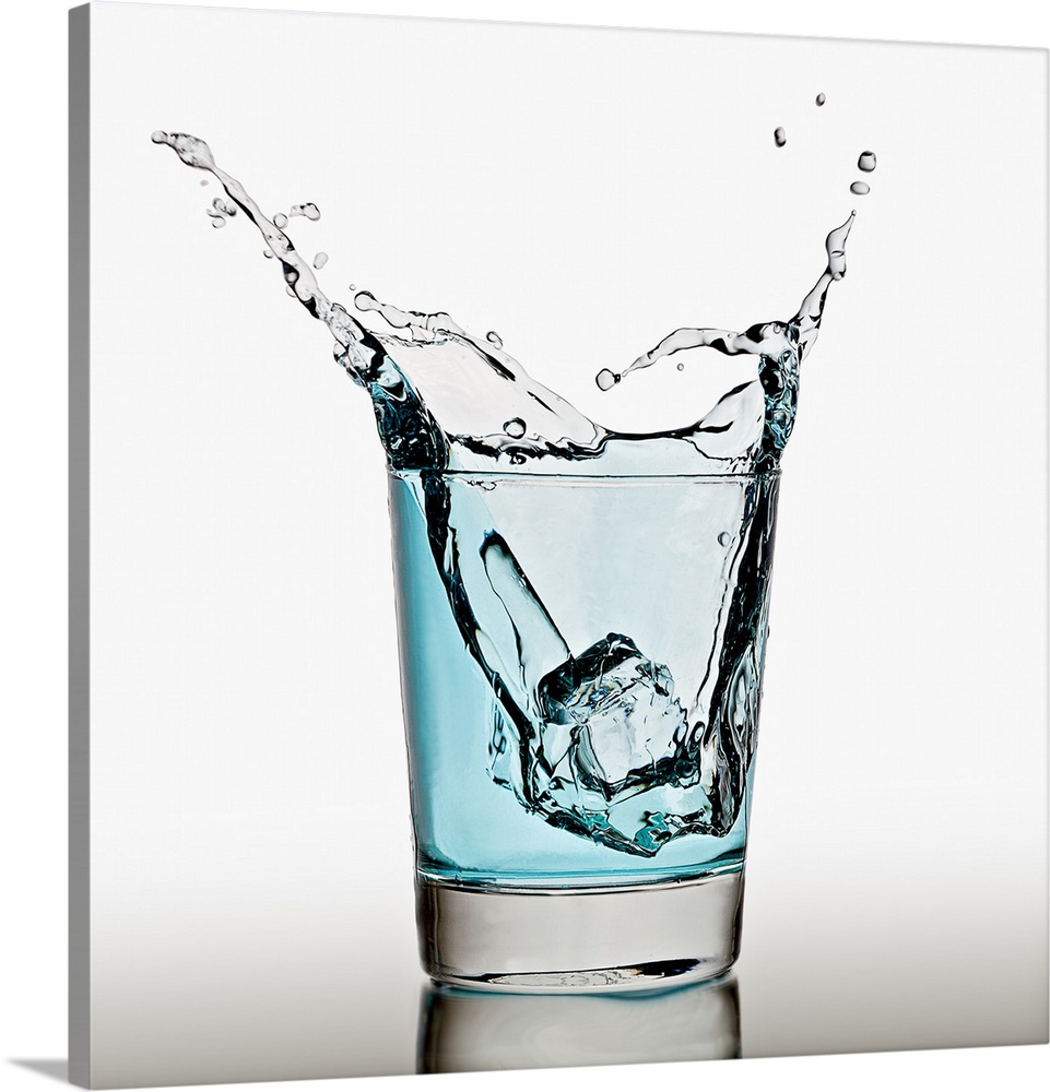 Ice cube splashing in a cool glass of water