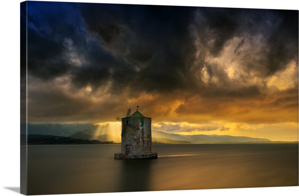 Landscape photograph of calm water and a dramatic sky in Italy.