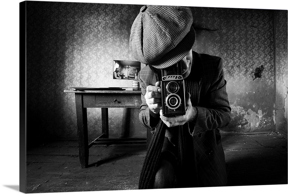 A man taking a photo with a vintage film camera in an abandoned room with peeling wallpaper.