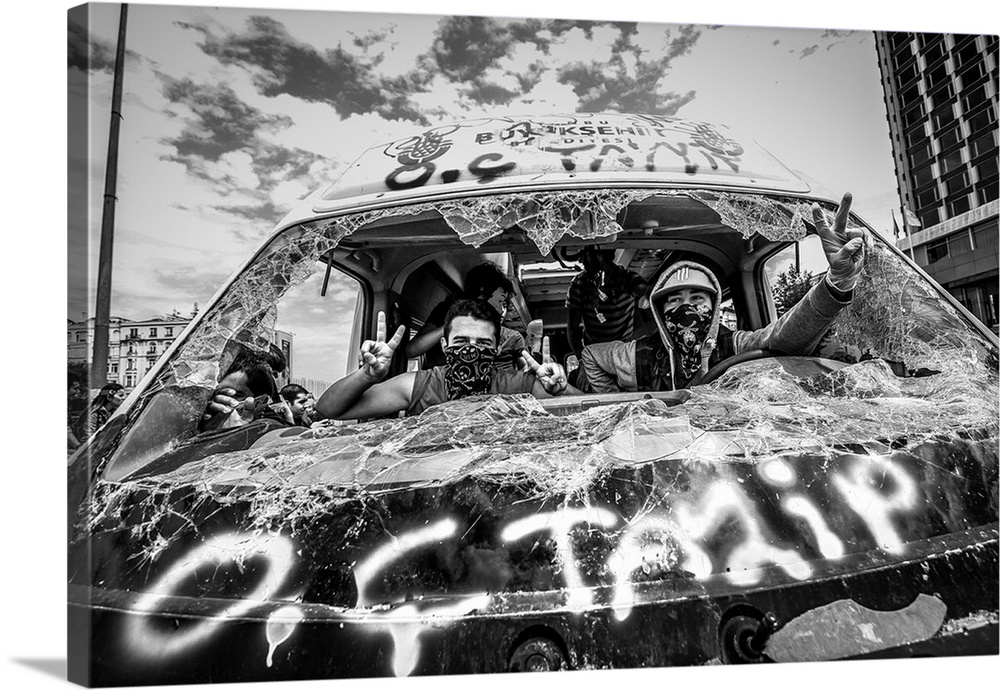 Protesters in the Occupy Gezi, Turkey, protests overtake a municipality van.