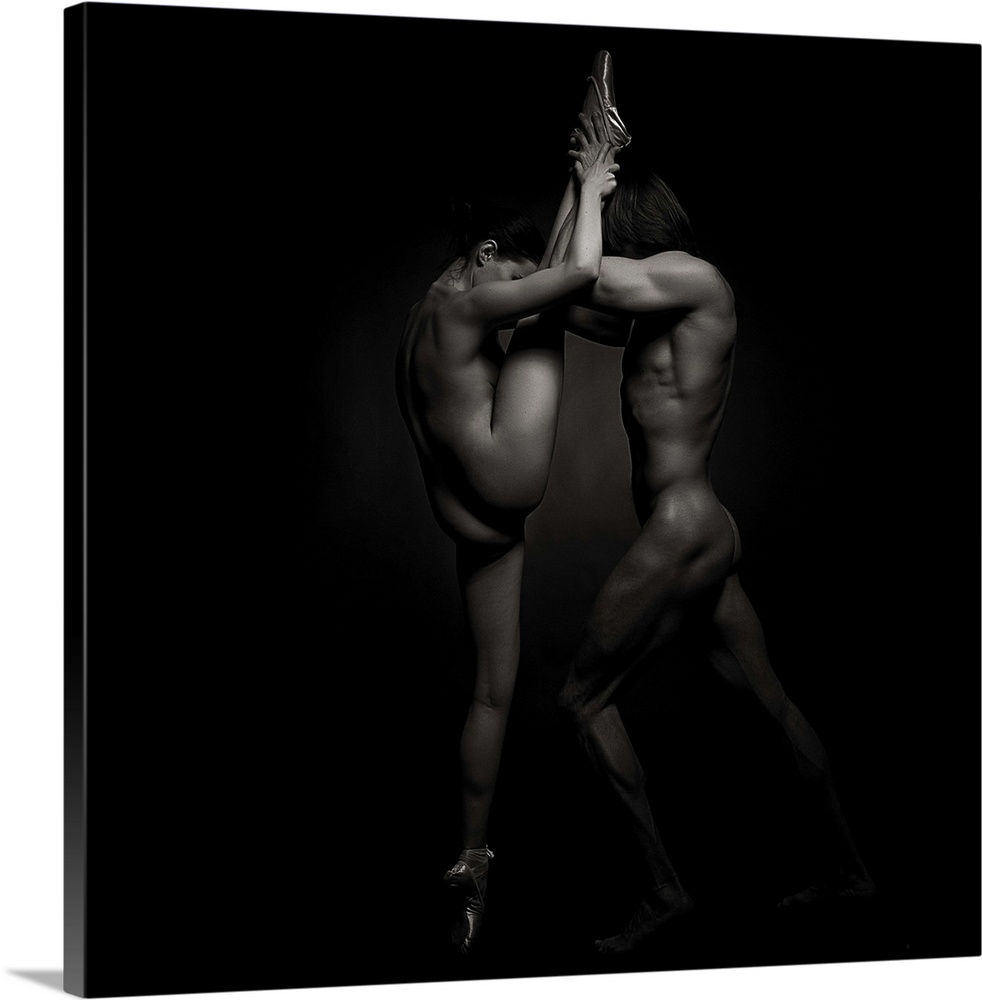Black and white square photograph of a male and female dancer posing together in low key lighting.