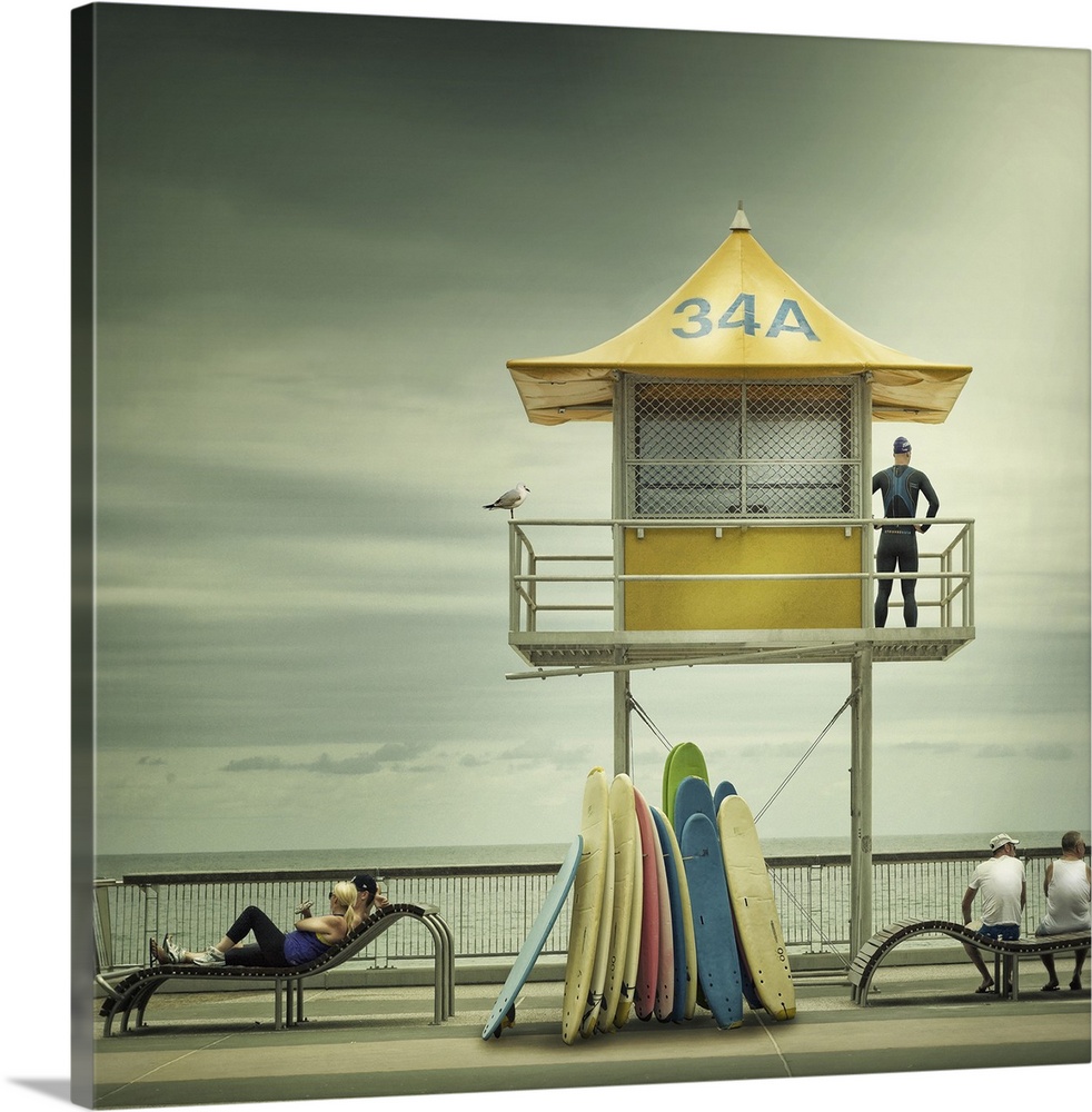 A lifeguard in a wetsuit keeping watch over the ocean in Surfer's Paradise, Australia.