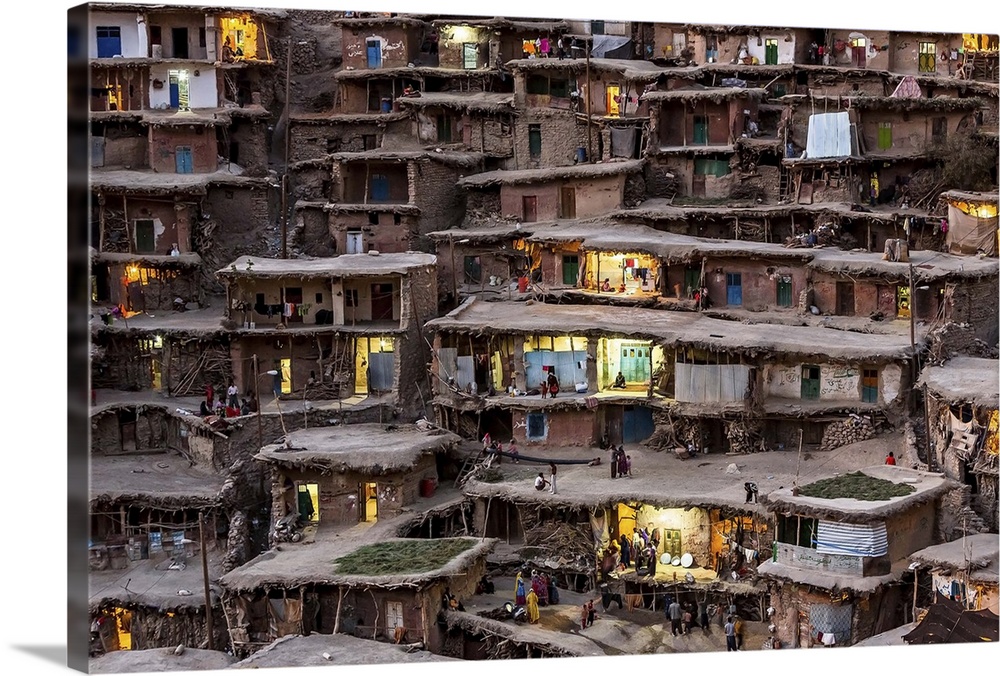 Homes in a village in Iran built into the side of a slope.