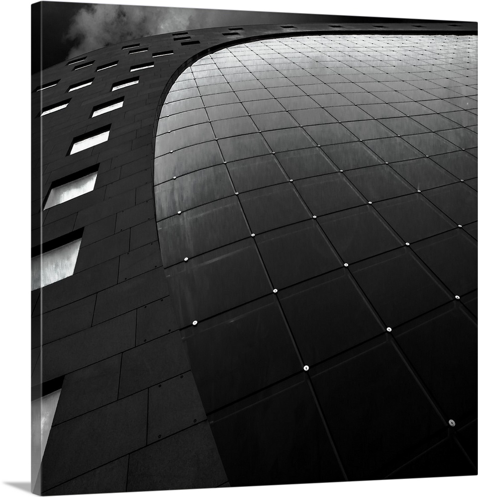 Curved building facade with windows and small lights in Rotterdam, Netherlands.