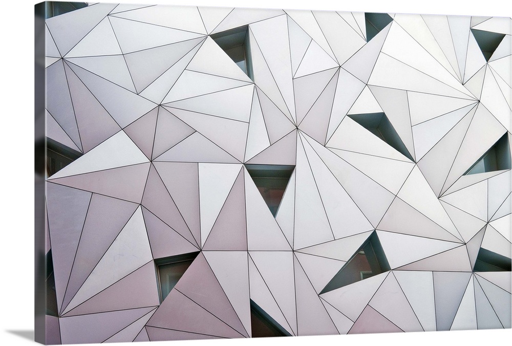 Abstract wall made of triangular shapes on a building in Madrid.
