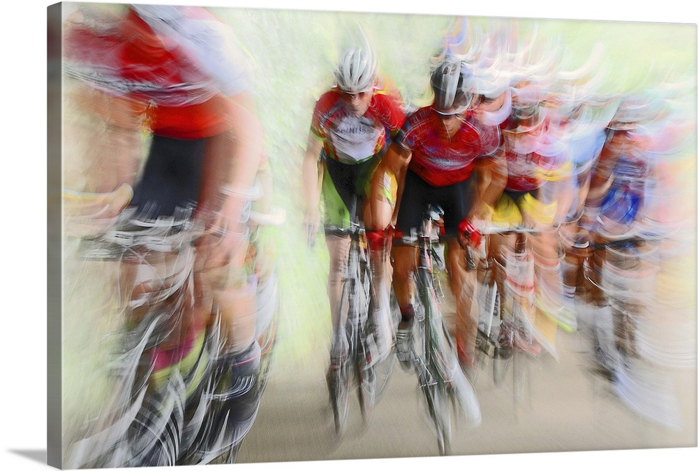 Action photograph of a cyclists in a blur of fast motion.