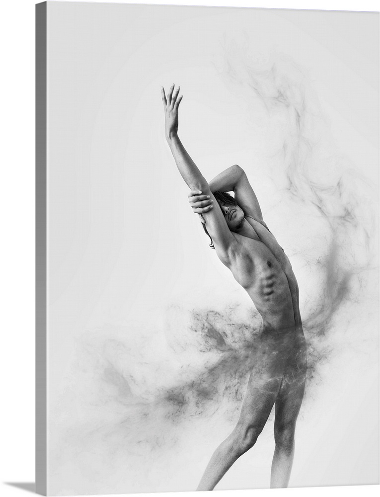 Black and white fine art photograph of a male model posing gracefully and gray smoke moving around his body.