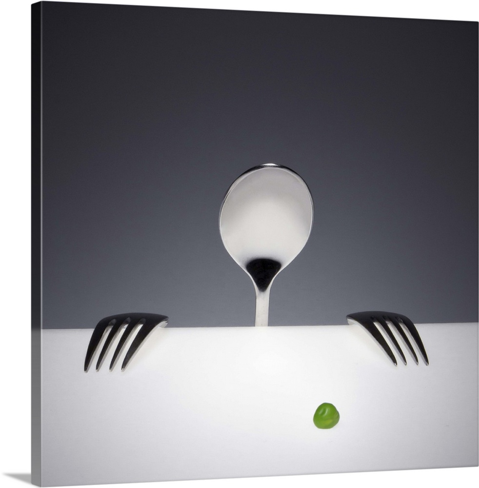 A spoon and two forks arranged to resemble a person looks at a single green pea.