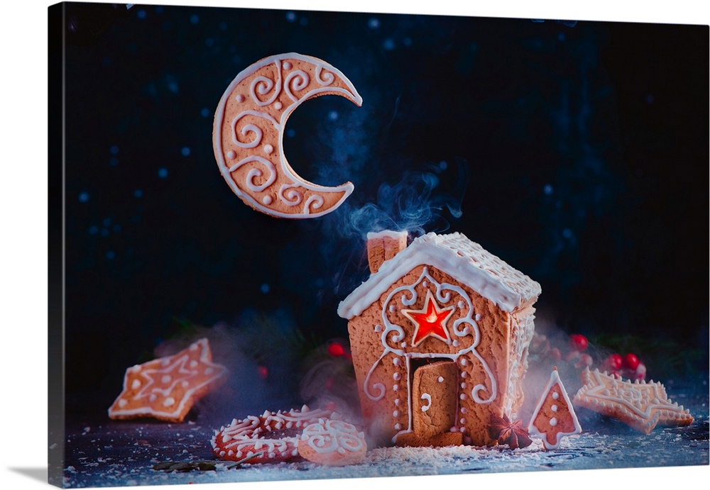 Christmas baking concept with a gingerbread house, shining caramel windows, biscuit Moon crescent and rising smoke from a ...