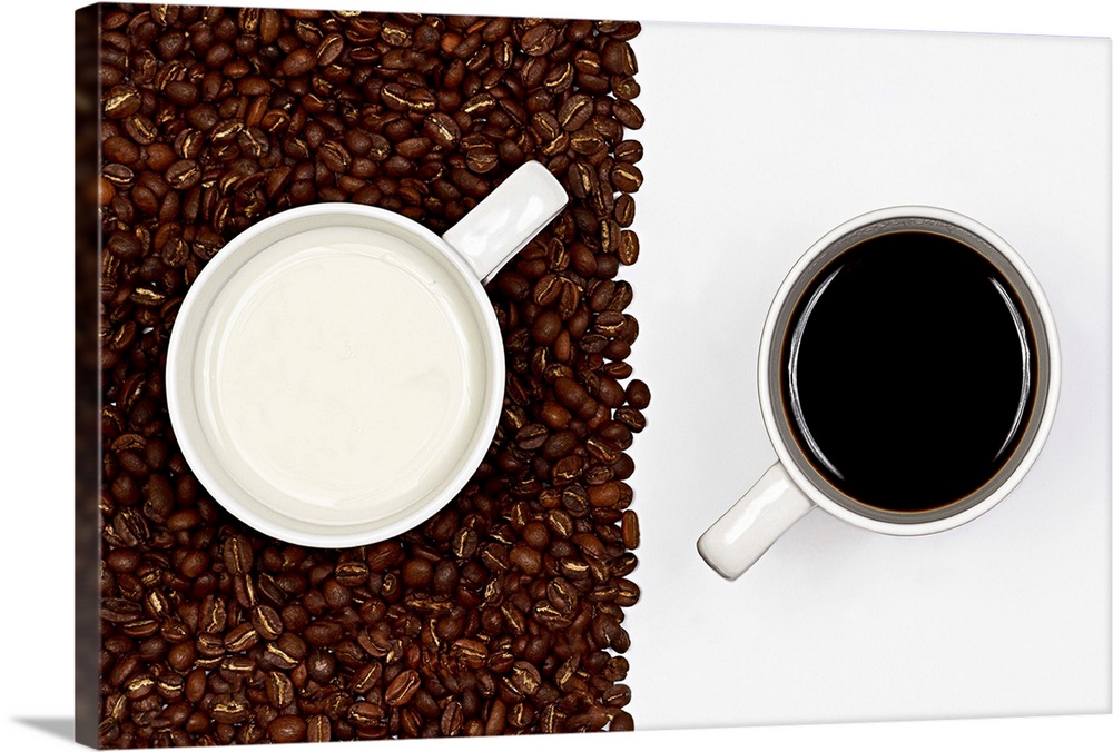 Two mugs, one on a blank surface and the other on coffee beans.