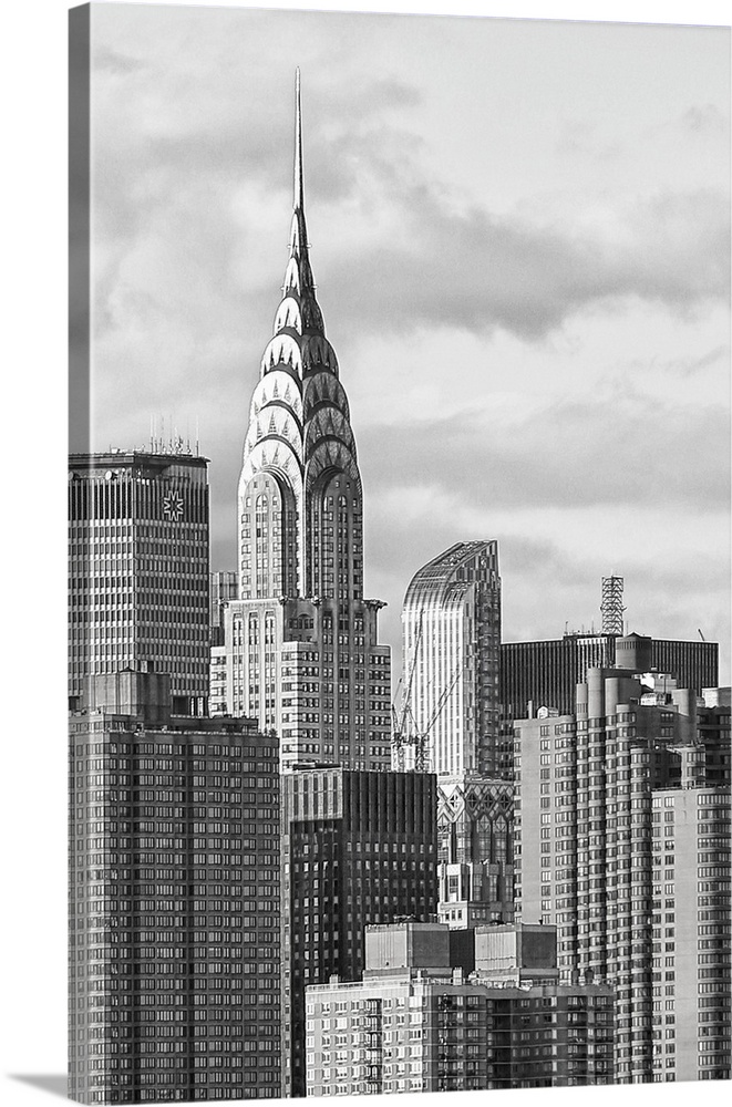 Black and white photograph of the New York City skyline. With the Chrysler building prominently standing tall.