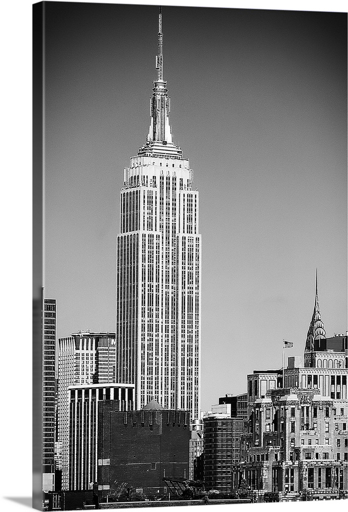 Black and white photograph of New York City. With the Empire State building prominently standing tall.