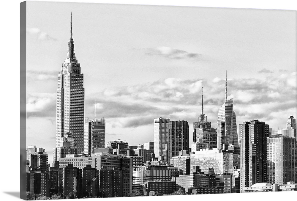 Black and white photograph of the New York City skyline. With the Empire State Building prominently standing tall.