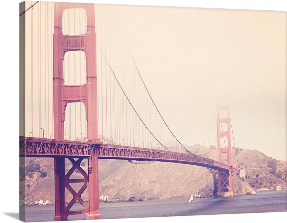 Artistically filtered photograph of the golden gate bridge shrouded in heavy fog.