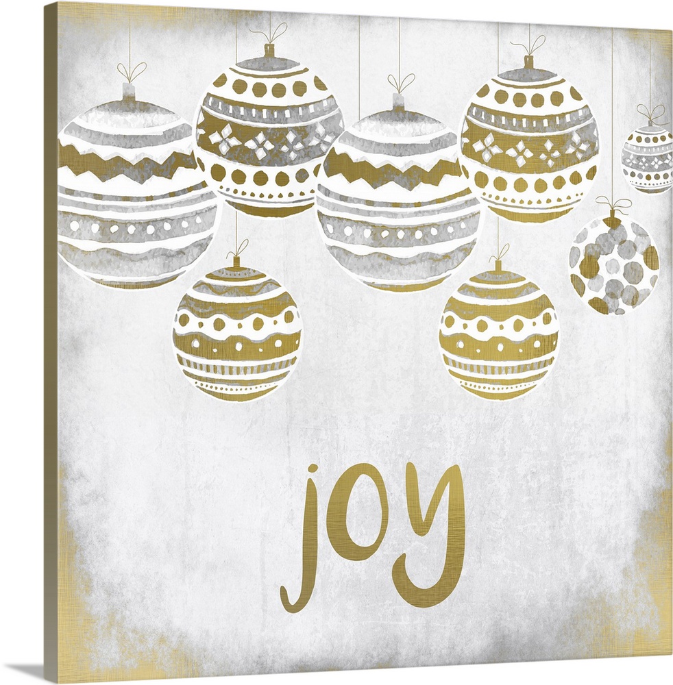 Gold and silver holiday ornaments hanging over the word "Joy."