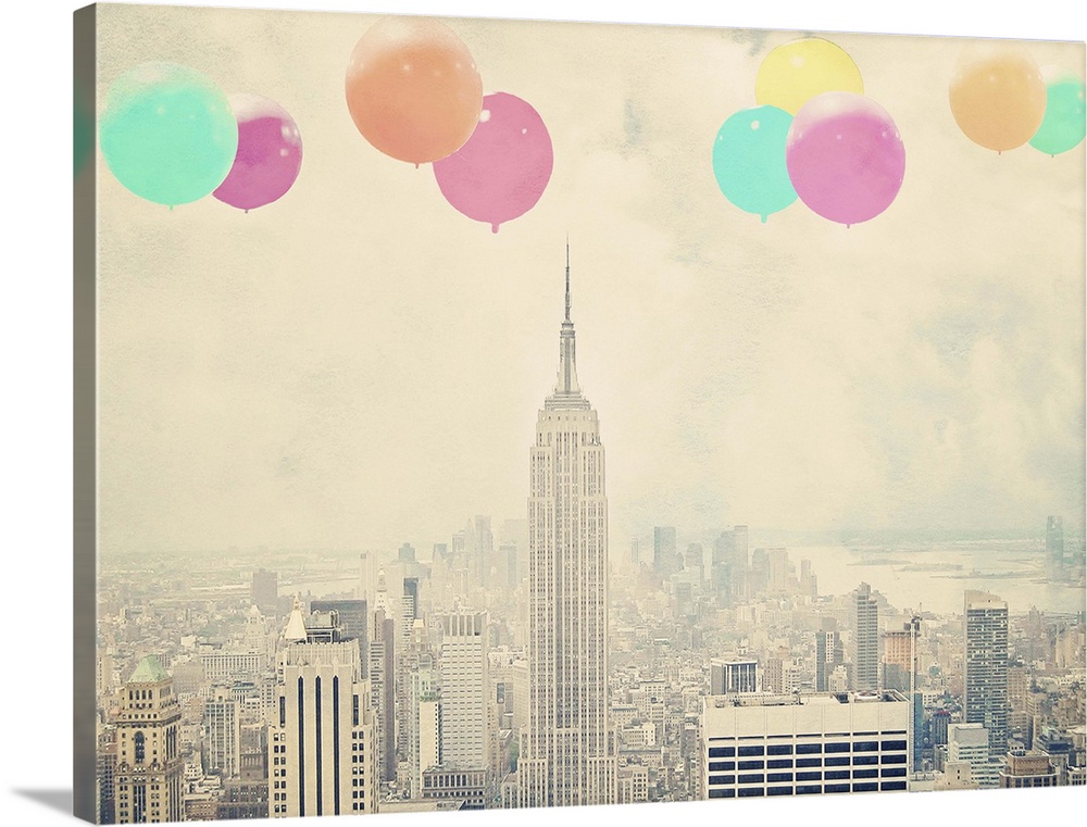 Artistically filtered photograph of the Empire state building in NYC, with bright balloons floating in the air.