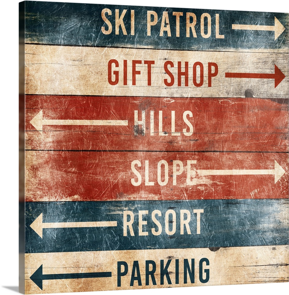 A wooden sign with arrows pointing the way to area at a ski resort.