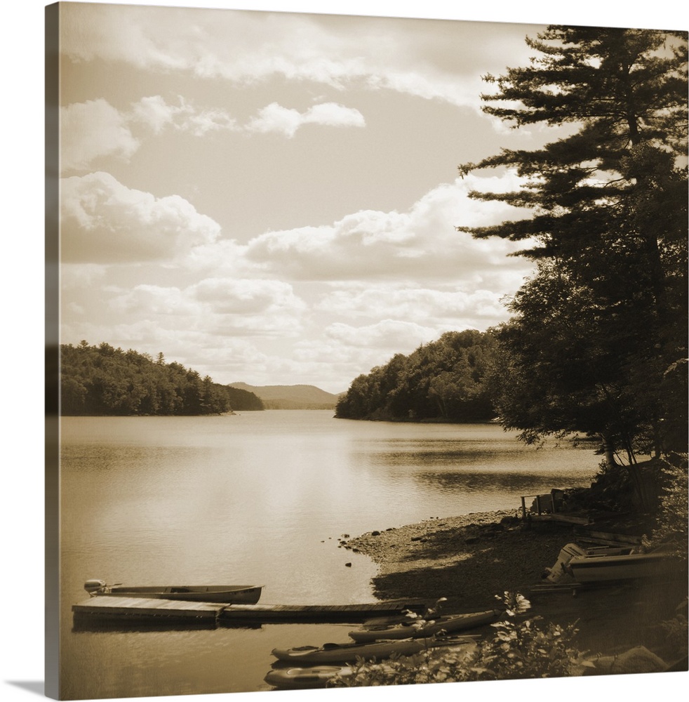 Sepia toned photograph of an idyllic wilderness scene, with lake and forest.
