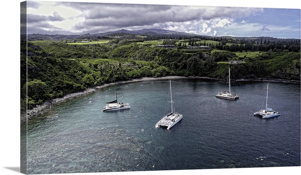 Catamarans in Honolua Bay, Maui, Hawaii. This is a three image aerial panoramic.