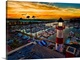 image thumbnail of Pelicans glide over the Oceanside Harbor and the little lighthouse glows. Colorful sunset in Oceanside, California, USA.