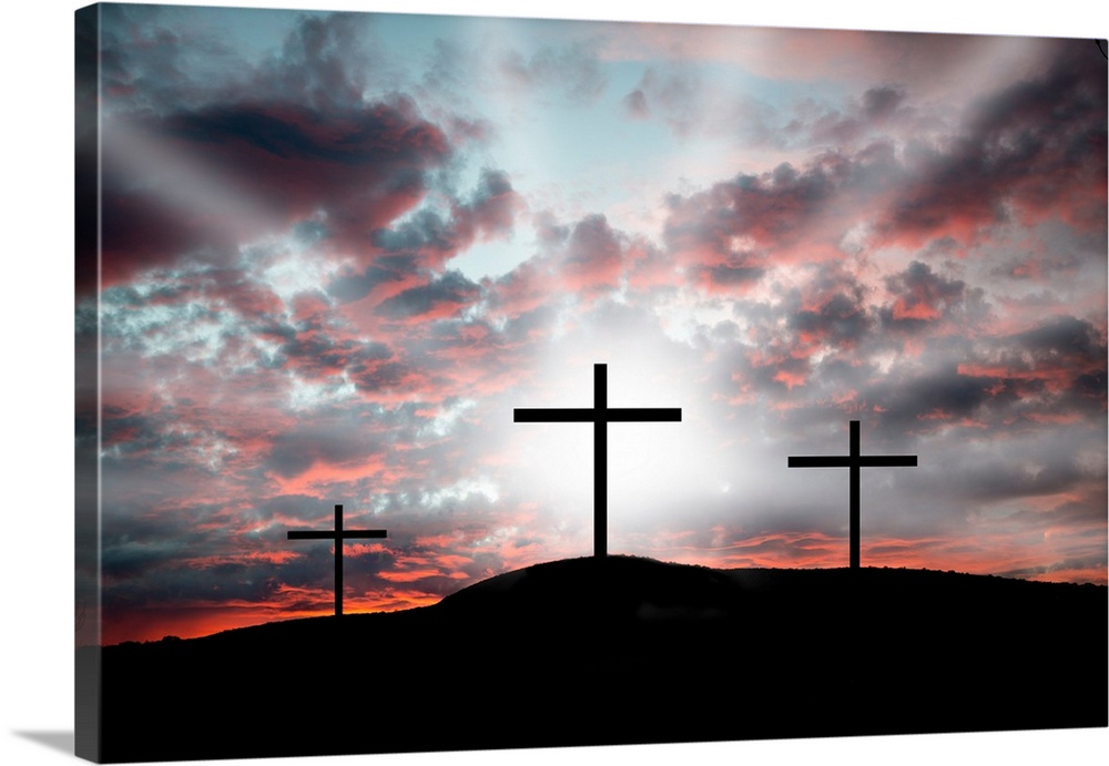 Three crosses on a hillside. Dramatic light announcing the resurrection.