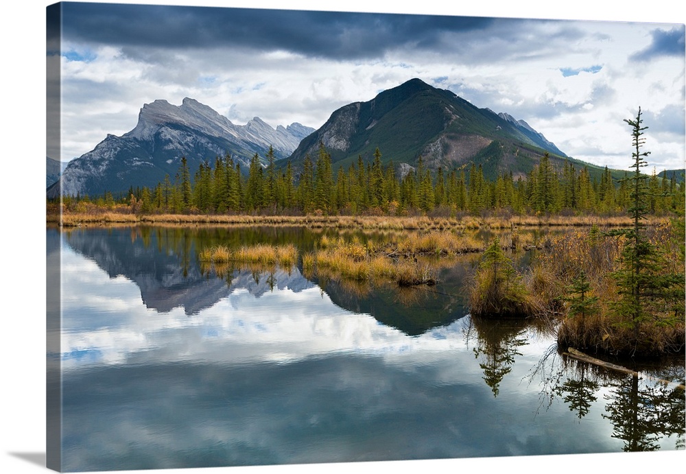 Reflections across Vermilion Lakes with view of Mount Rundle and Sulfer Mountain in the distance. The town of Banff is in ...