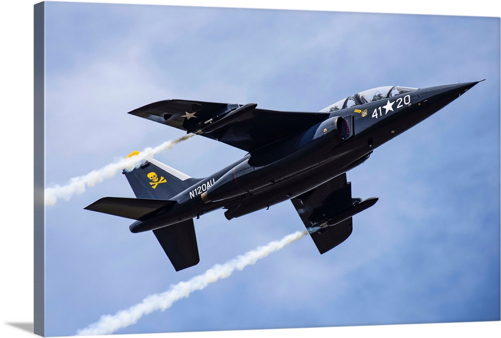 The 1981 DORNIER GMBH ALPHA-JET trailing smoke while performing aerobatic manoeuvres in the 2019 Olympic Air Show, Olympic...