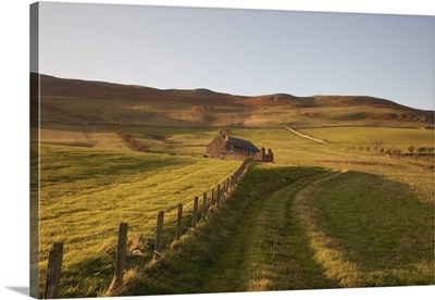 A Farm Structure And A Fence Around A Field, Northumberland, England