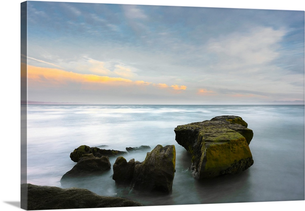 A long exposure seascape made along a rocky beach in Santa Cruz, California, United States of America