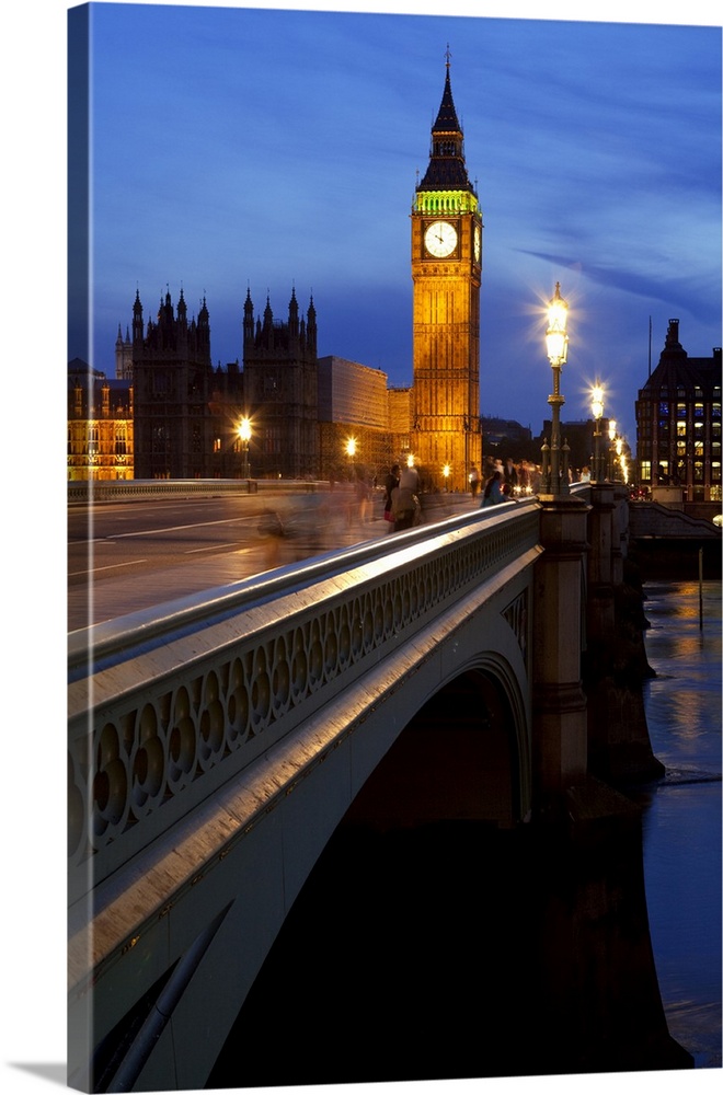 A night view across Westminster Bridge with Big Ben in the distance.