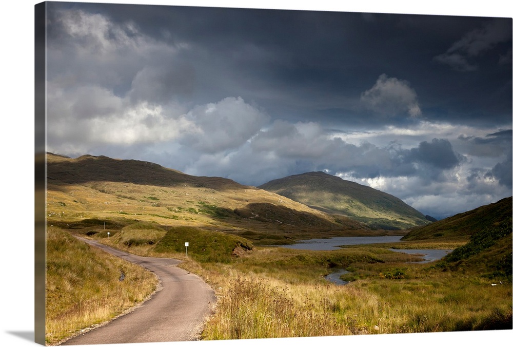 A Road Curving Through A Mountainous Landscape. Ardnamurchan, Argyl, Scotland.