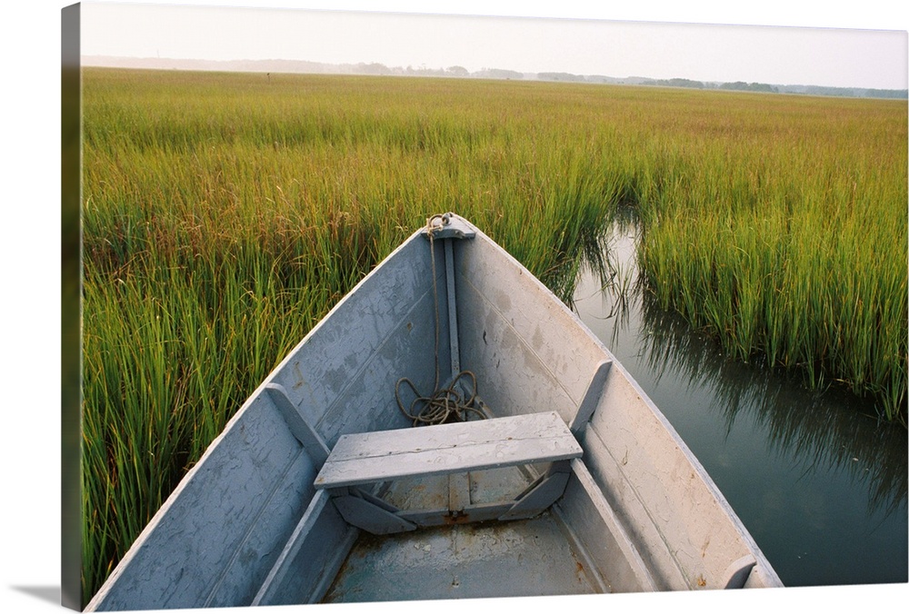 A rowboat rests in the marsh of Assateague Island.