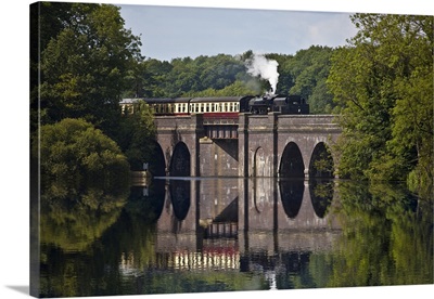 A Steam Train On Swithind Reservoir Viaduct, Leicestershire, UK