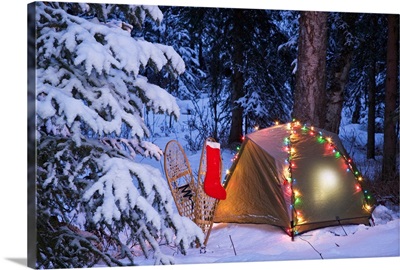 A Tent Set Up In The Woods With Christmas Lights And Stocking Near Anchorage, Alaska
