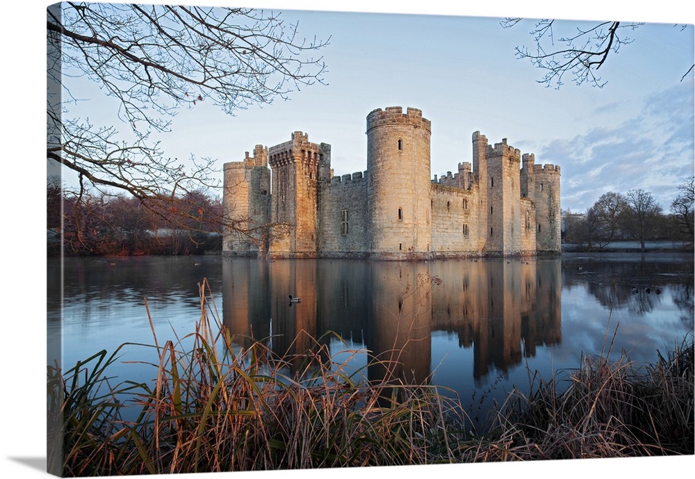A view of Bodiam Castle with reflection in the water.